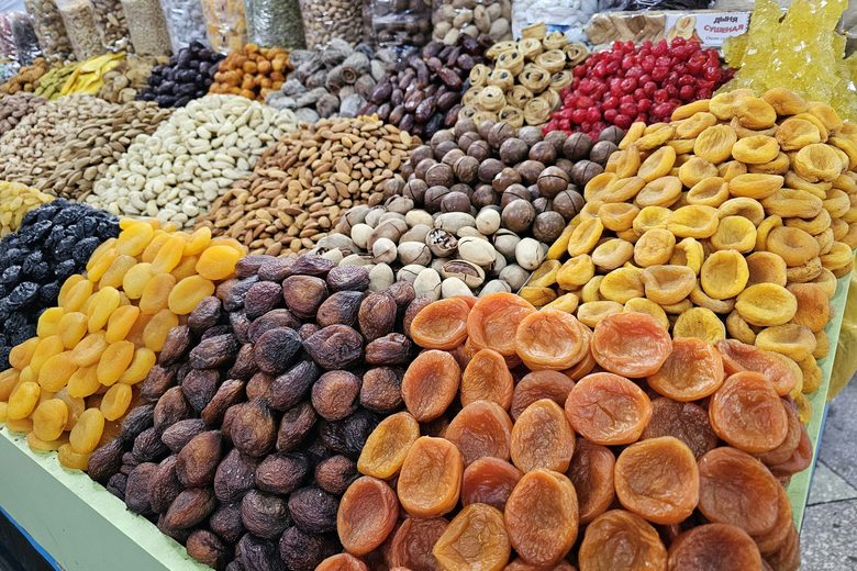 A market display of dried fruits including apricots, figs and dates