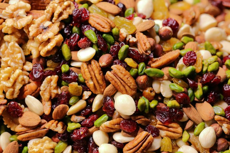 A mix of nuts including pecans, pistachios, almonds and walnuts